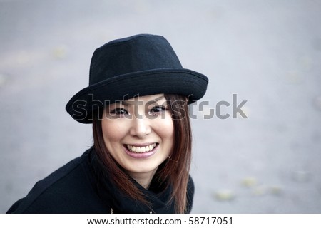 Fashion model poses in Central Park New York.  She was 23 at the time of shoot and of Japanese ethnicity.  Photographed November, 2007.