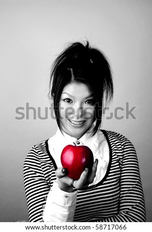 Asian woman with apple.  She is Japanese and was 23 years old at the time of shoot.  Photographed in my New York studio.