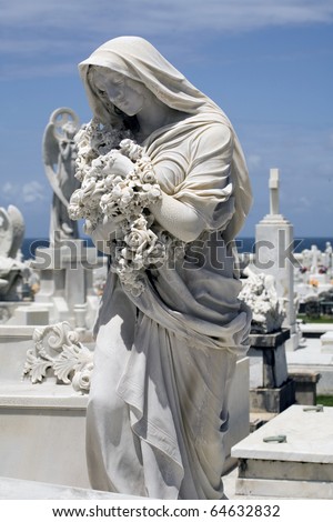 statue of woman in mourning at a cemetery in Old San Juan Puerto Rico.
