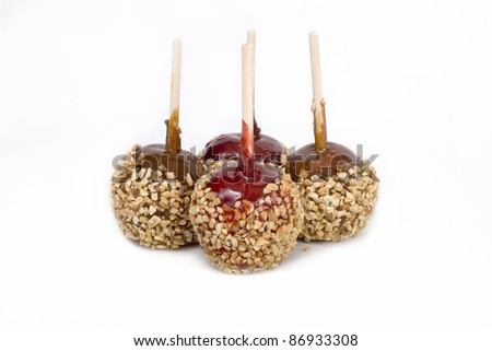 Candy apples, also known as toffee apples against a white background.