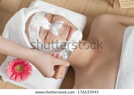 A young woman enjoying spa mask