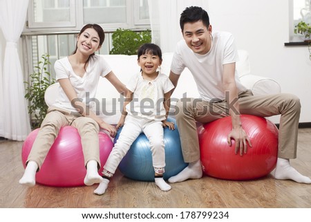 Young family and fitness ball