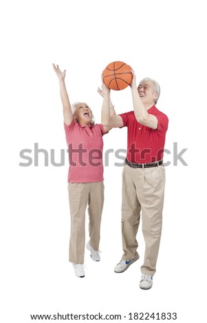 Senior couple holding basketball