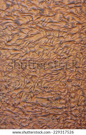 Decorative relief brown and black plaster closeup