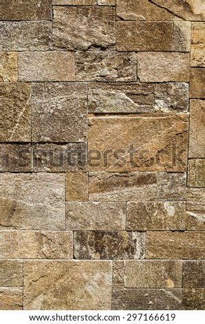 Colorful relief cladding gneiss slabs on wall closeup