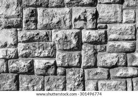 Old stone wall closeup  in sunny day