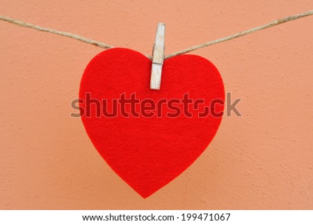 Red heart hanging on a string