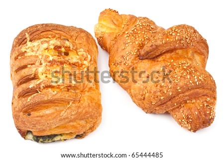 Croissant with sesame seeds and bun with cheese and spinach isolated on a white background