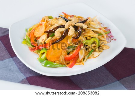 Pad cashew nut with chicken sauteed, white onions, green onions, carrots, dried chili