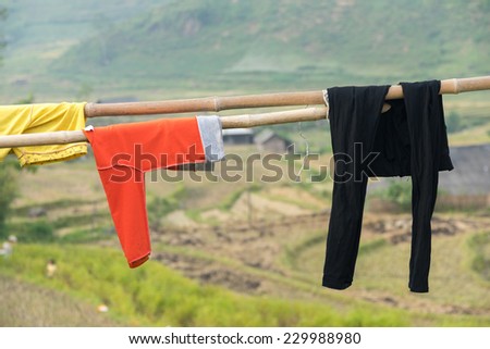 Drying clothes on the Mountain hanging on bamboo exposed to sun light