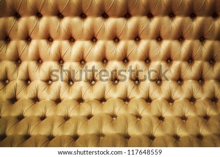 Golden leather luxury background close-up