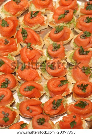Smoked salmon, capers and parsley on toasted bread with butter