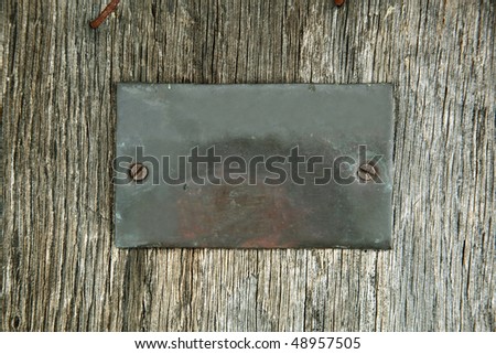 Metal shield on timber wall