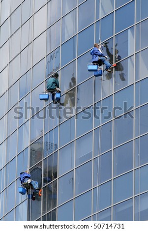 Window washers on a highrise office building in downtown