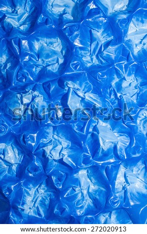 Detail of blue plastic damaged pallet, abstract background.