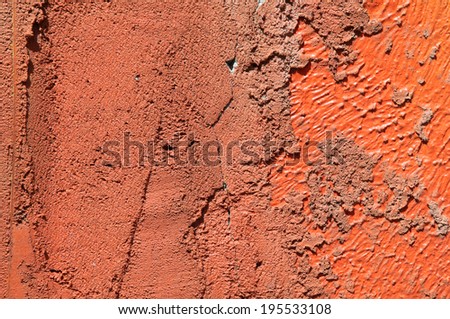 High quality textured and abstract weathered natural scratched orange paint pattern with aged and grunge look which can be used as a wallpaper or background