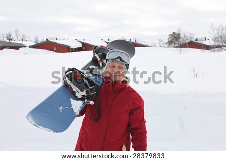 Women carrying a snowboard