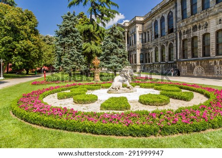 ISTANBUL, TURKEY - JUN 22, 2014: A flower bed with the figure of a lion in the park of the palace of the Ottoman sultans Dolmabahce, 1853