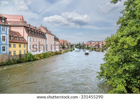 BAMBERG, GERMANY - JUL 12, 2015: Old buildings in the historic center of the city on the banks of the Regnitz river. Historic city center of Bamberg is a listed UNESCO world heritage site