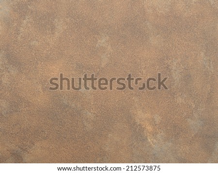 rough texture of beige, gold and brown color walls with decorative spots and dots