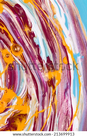abstraction of vertical lines of brightly colored acrylic gold blue and white paint mixed