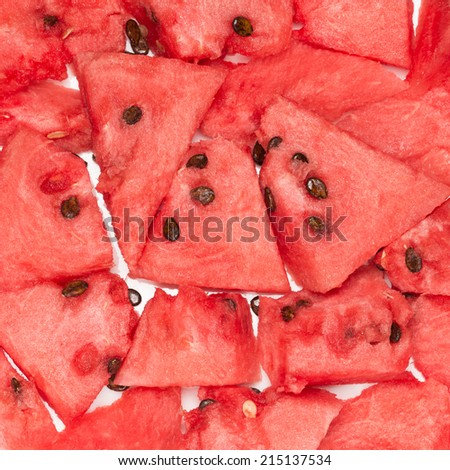 pieces of fresh red juicy watermelon and dark seeds