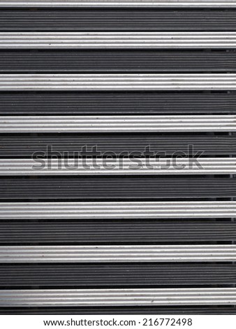 texture of gray metal and black rubber band in the street Carpet