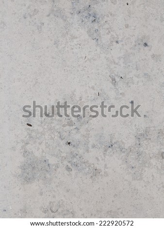 large slab of mottled light gray and dark gray marble with a smooth polished surface and smooth spots