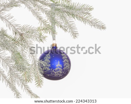 bright blue ball with silver pattern hanging on a Christmas tree covered with snow on white background