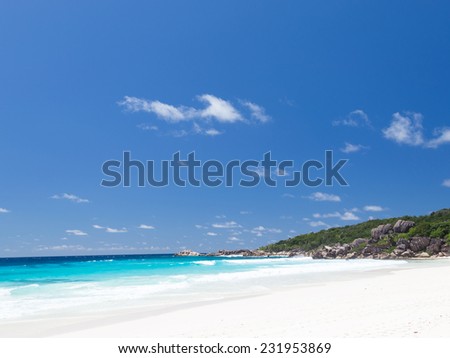 Best beach Anse Lazio with white fine clean sand on the island of Praslin Seychelles and large granite stones from the rainforest