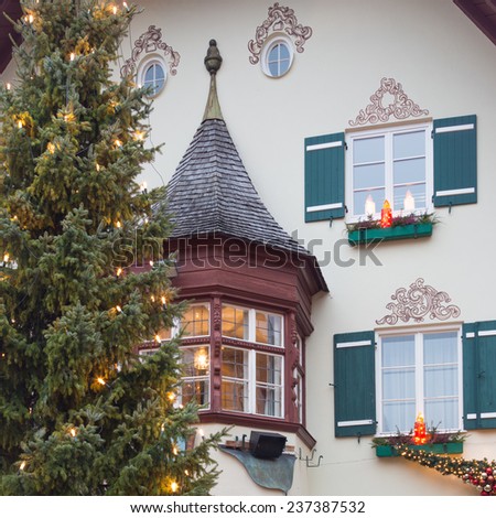 Mondsee - December 4, 2014 - candles on the windows of the house and Christmas tree in the suburbs of December 4, 2014 Mondsee, Mondsee, Austria