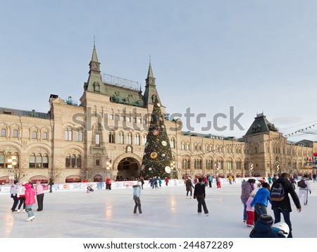 Moscow - January 16, 2015: Winter skating rink on Red Square with Christmas fir and people are skating January 16, 2015 Red Square, Moscow, Russia