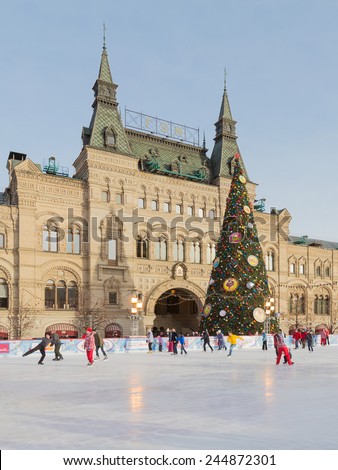 Moscow - January 16, 2015: Winter skating rink on Red Square with decorated Christmas fir and people are skating January 16, 2015 Red Square, Moscow, Russia