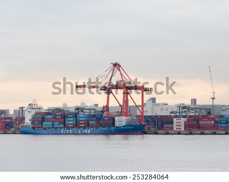 Tokyo - February 7, 2015: Loading of the ship in the port of February 7, 2015, Tokyo, Japan