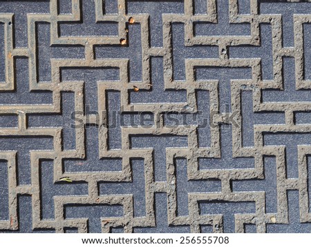 gray geometric pattern of cement on the wall