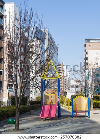 Tokyo - February 4, 2015: A small playground is sandwiched between houses in a huge city February 4, 2015, Tokyo, Japan