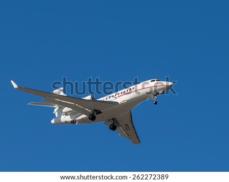 Sheremetyevo - March 14, 2015: Airplane Falcon 7x, is landing at Sheremetyevo Airport on a background of bright blue sky March 14, 2015, Sheremetyevo, Moscow Region, Russia
