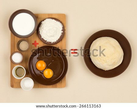 yeast dough and eggs, milk, flour, yeast and other Ingredients for making dough and red plus signs, and equal to the beige cloth tablecloths