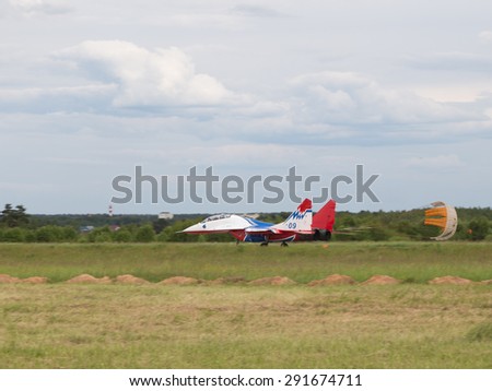 Moscow Region - June 17, 2015: Powerful military aircraft MiG-29 Swifts aerobatic team performs a landing in the international military-technical forum ARMY-2015 June 17, 2015, Moscow Region, Russia