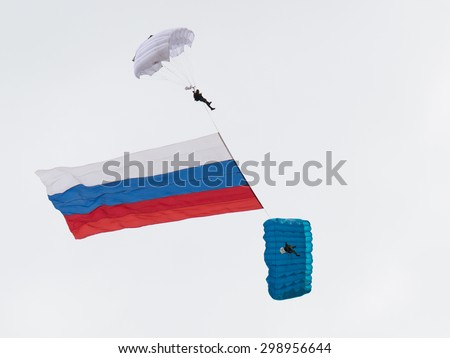 Moscow Region - June 17, 2015: Two military parachutist fly in the sky with the flag of Russia on the international airshow on military-technical forum ARMY-2015 June 17, 2015, Moscow Region, Russia