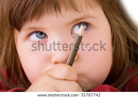 child writes, girl wrote a children's hand with a pencil sheet of white paper with a picture sleeve on red soft background on a table studying a happy childhood education