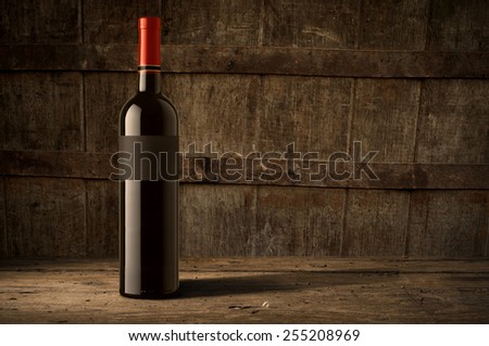 wine bottle on wooden barrel