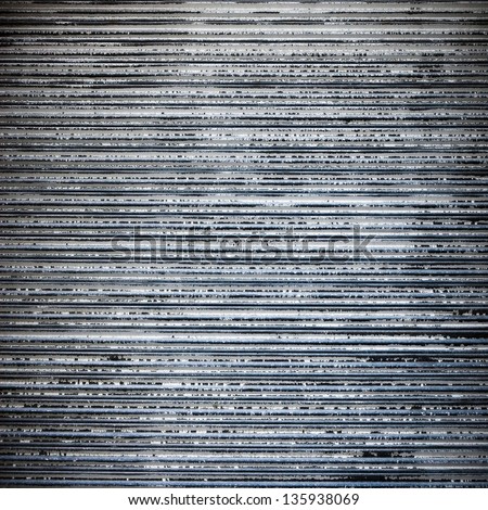striped metal garage wall ; grunge industrial background