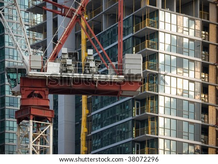 modern glass high-rise  and building under construction background