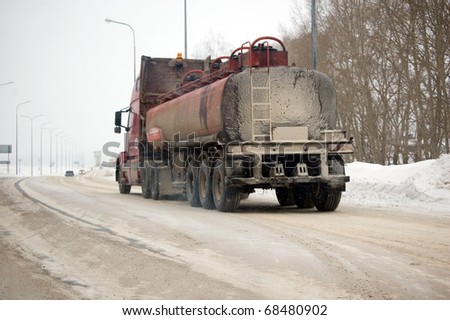fright cargo cranes , winter road , fuel  truck , industry background