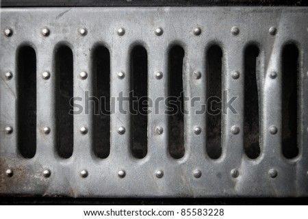 holes in a tin plate,  metal background