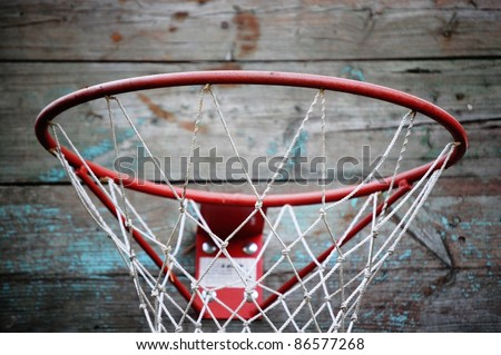 close-up of basketball hoop against weathered wooden wall,  sport object