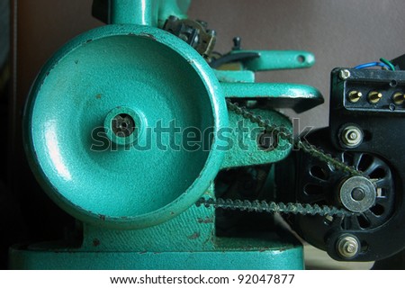 close-up of belt drive of electrical sewing machine
