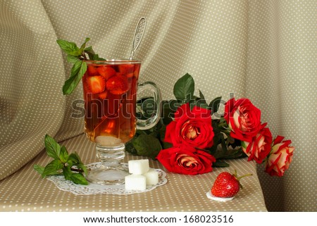 Strawberries, roses and a hot drink