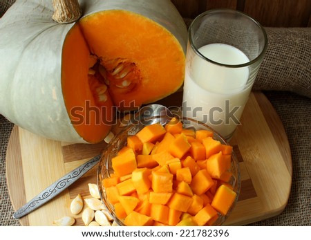 Pumpkin, diced for cooking recipe and a glass of milk